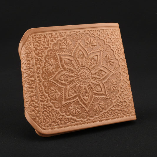 Beige leather wallet with embossed design on a black background