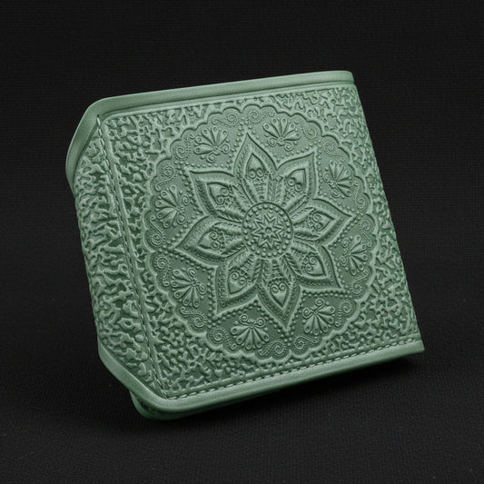 Green textured wallet with floral design on a white background