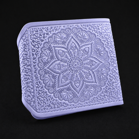 Decorative lavender square with intricate floral pattern on a black background