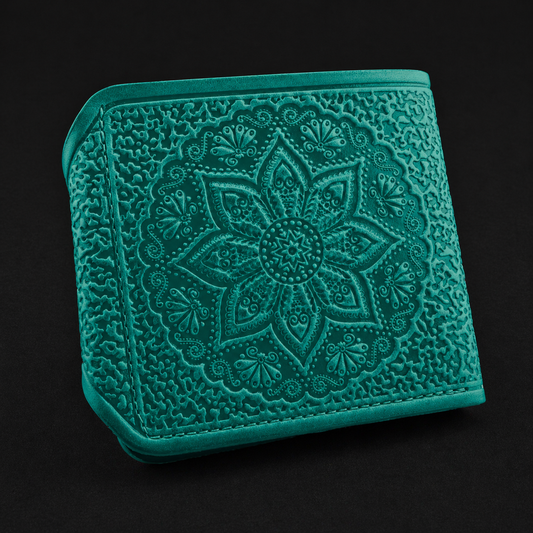 Teal embroidered wallet with floral pattern on a black background