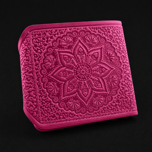Pink embroidered wallet with intricate patterns on a black background