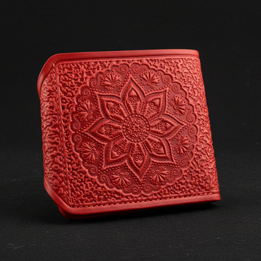 Red textured wallet with floral design on a white background