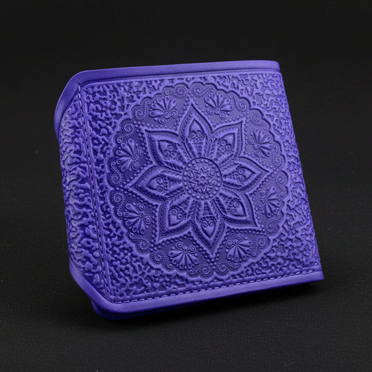 Purple embossed wallet with a floral design on a black background