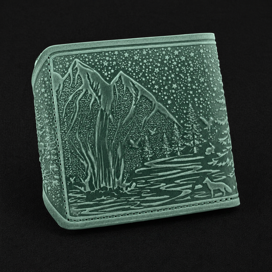 Gray wallet with mountain and forest design on a black background