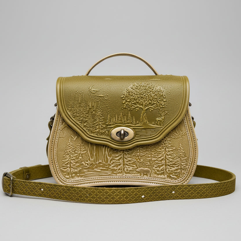 Cognac-ivory textured handbag with a scenic design on a stone surface with a garden background