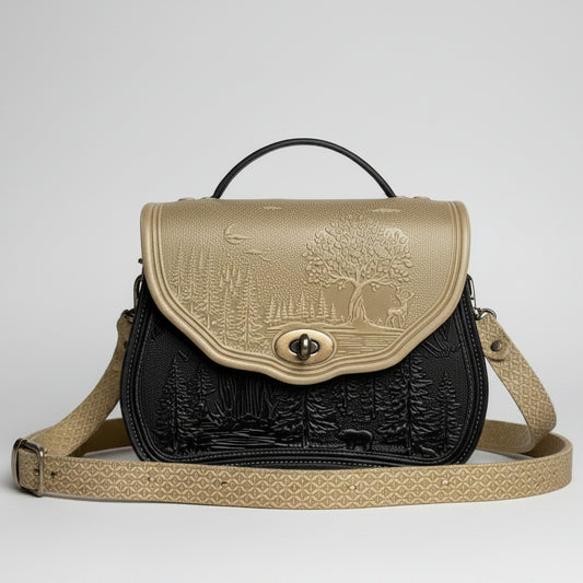 Handbag with nature-themed design on a stone surface with a garden background
