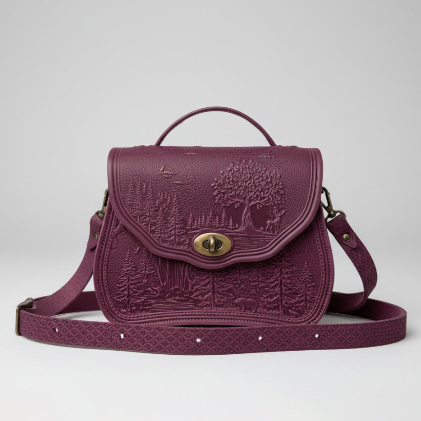 Purple embossed bag with a tree design on a light gray background