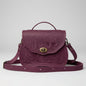 Purple embossed bag with a tree design on a light gray background