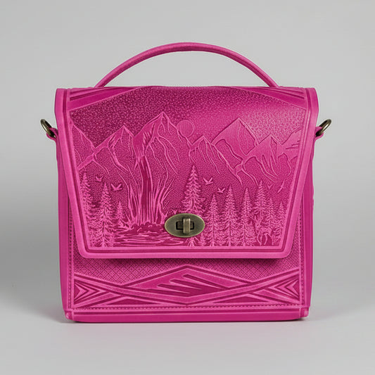 Pink embossed bag with nature design on a white brick wall background