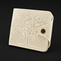 Ivory embossed wallet with tree design on a black background