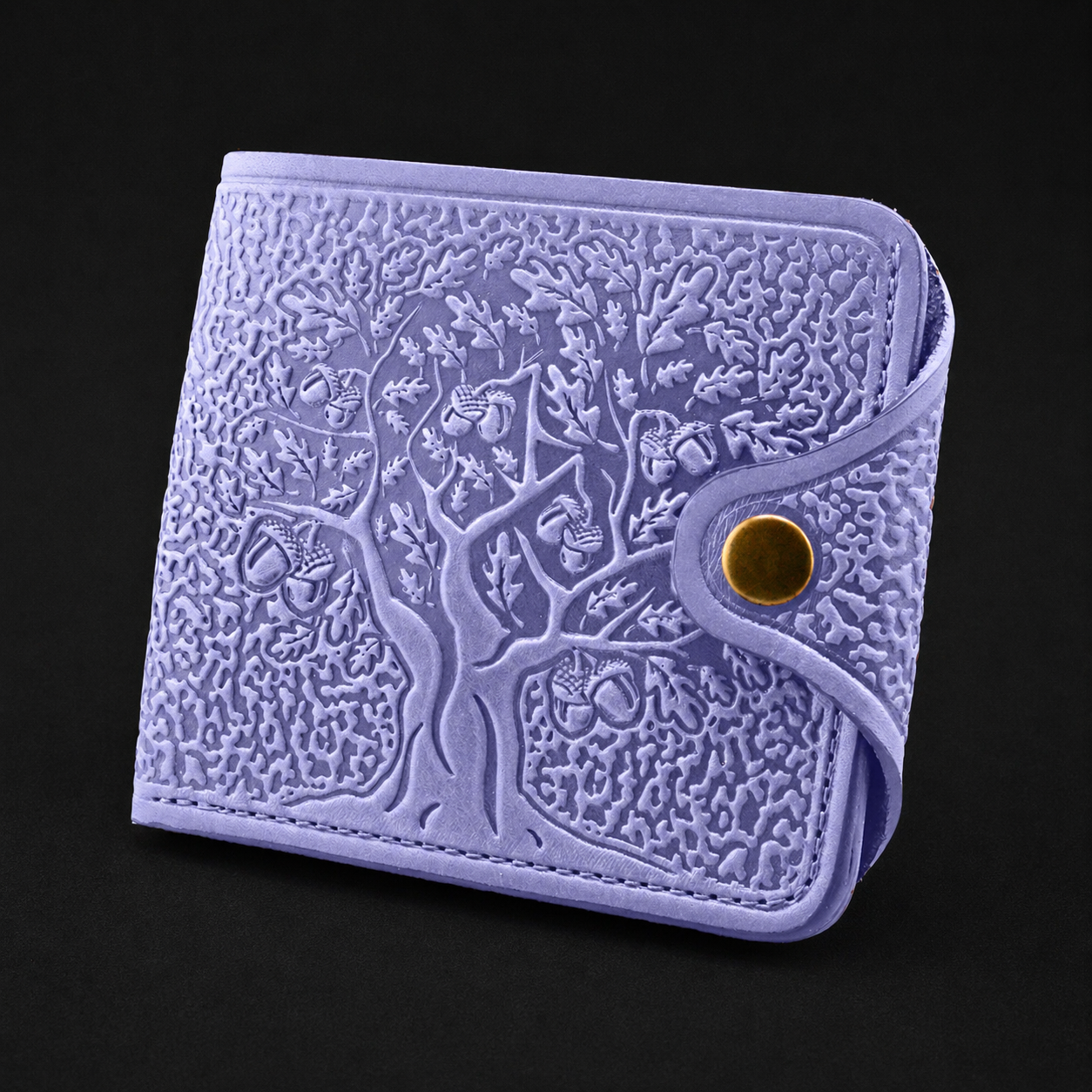 Purple embossed wallet with a gold button on a black background