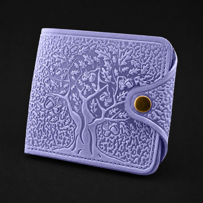 Purple embossed wallet with a gold button on a black background