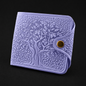 Purple embossed wallet with a gold button on a black background