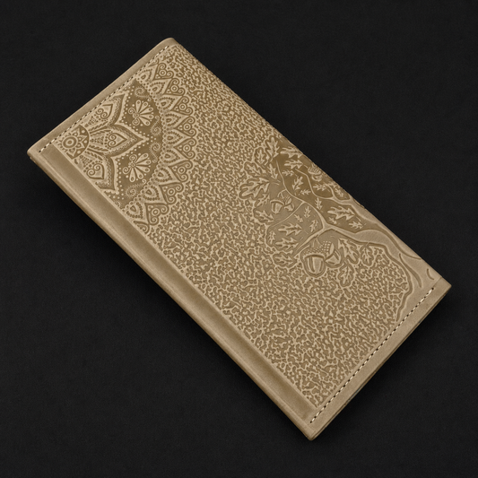 Beige leather wallet with intricate patterns on a black background