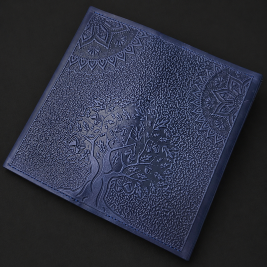 Blue textured wallet with embossed design on a black background