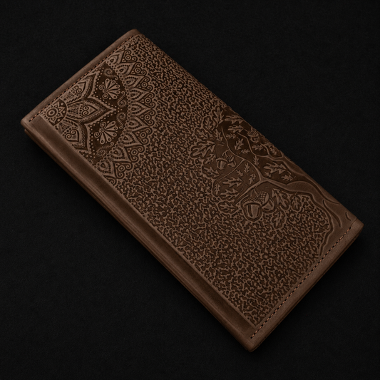 Brown leather wallet with intricate patterns on a black background