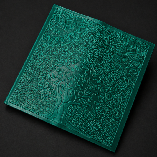 Green textured book on a black background