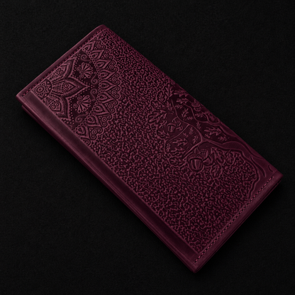 Purple embossed wallet on a black background