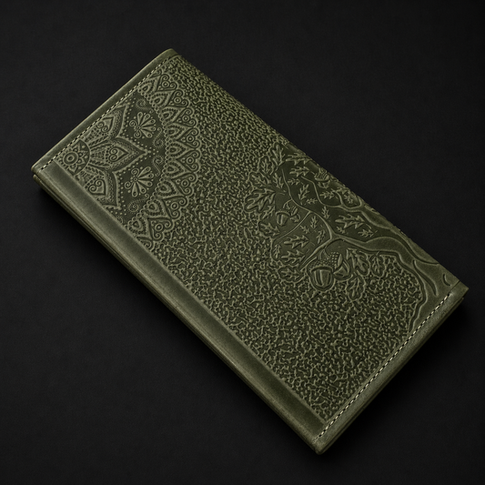 Green embossed leather wallet on a black background