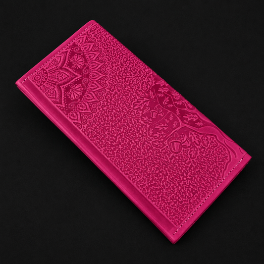 Pink embossed wallet on a black background