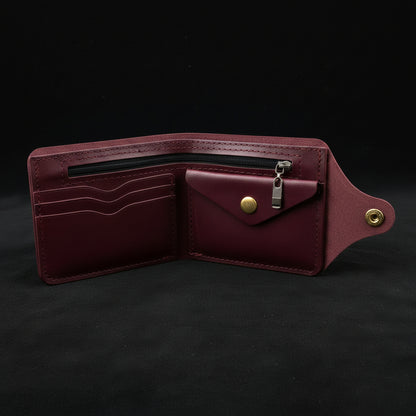 Burgundy leather wallet with zipper on a black background