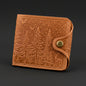 Brown leather wallet with forest design on a black background