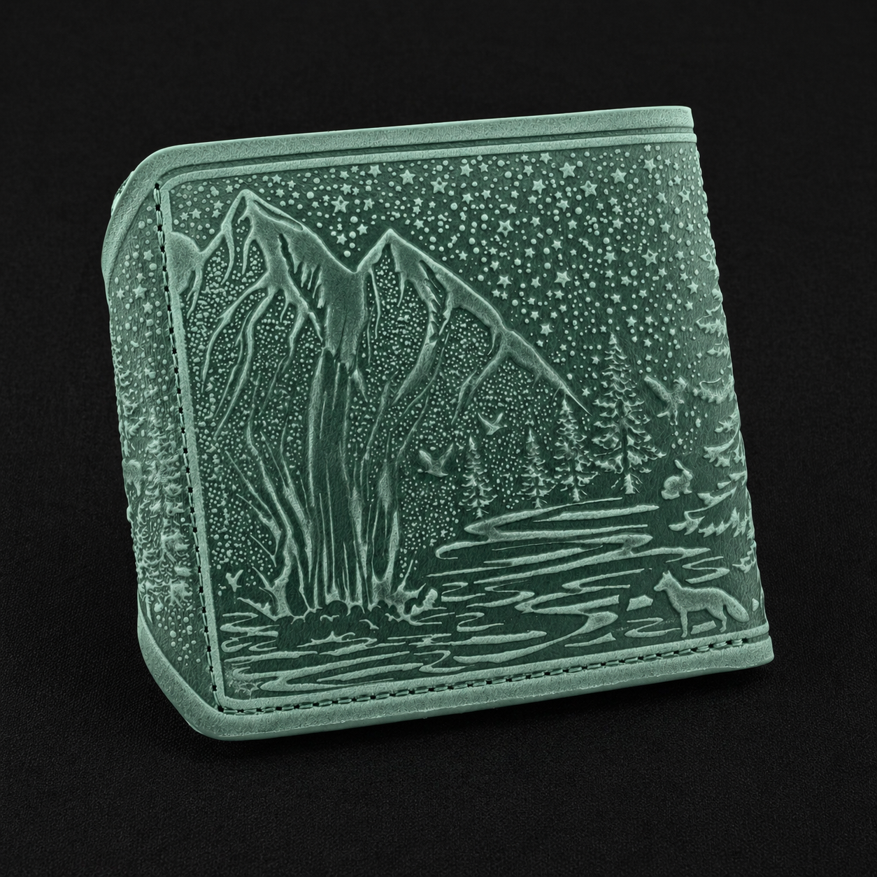 Gray wallet with mountain and forest design on a black background