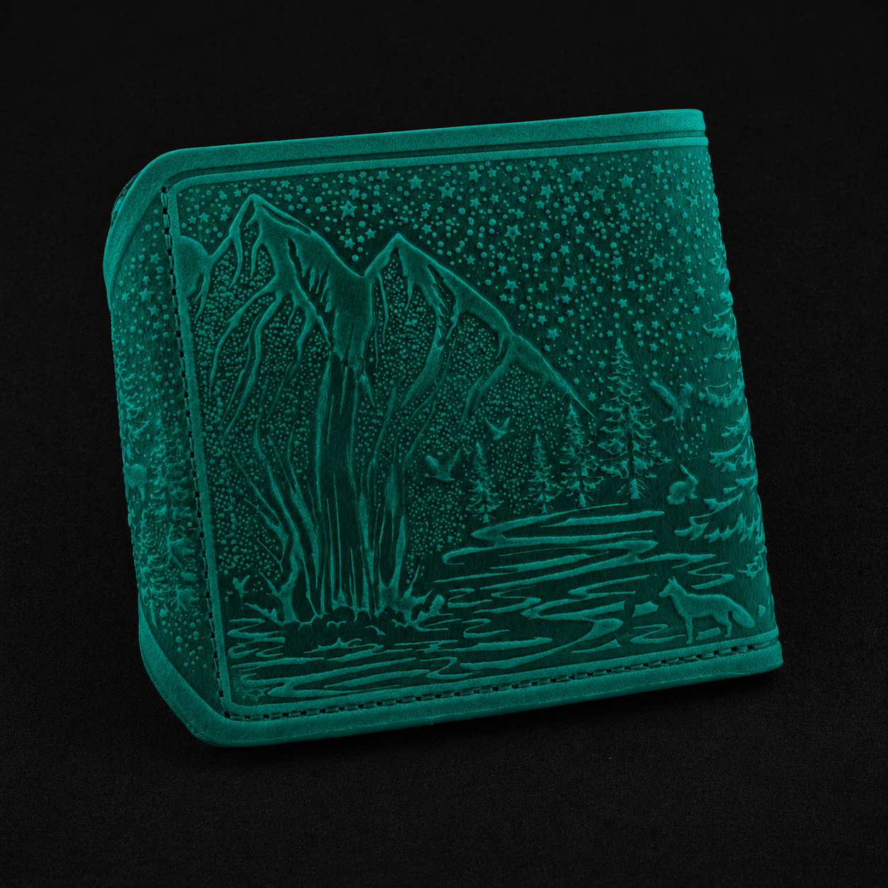 Mint wallet with mountain and forest design on a black background
