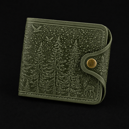 Green wallet with forest design on a black background