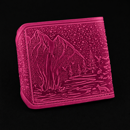 Pink wallet with mountain and lake design on a black background