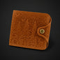 Brown leather wallet with embossed design on a black background