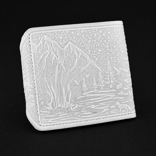 White embossed wallet with nature design on a black background