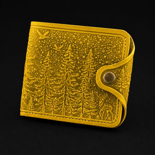 Yellow wallet with forest design on a black background